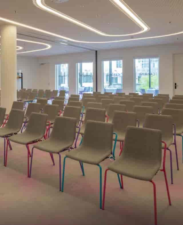 Modern event space with minimalist chairs, perfect for workshops and presentations.