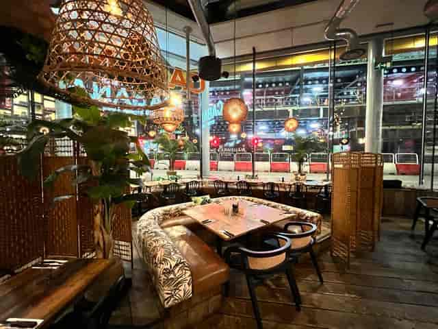 Stylish event space with natural light, ideal for networking and private gatherings.