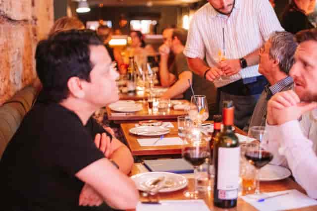 Lively dining in The Charcol Room, ideal for networking events and intimate gatherings.