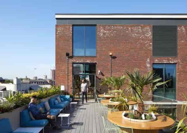 Stylish rooftop venue with greenery for networking events and cocktail receptions.