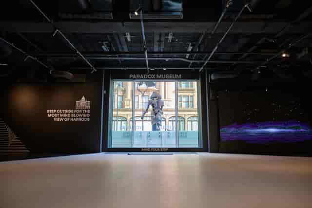 Modern event space in Paradox Museum London with large window, ideal for corporate meetings.