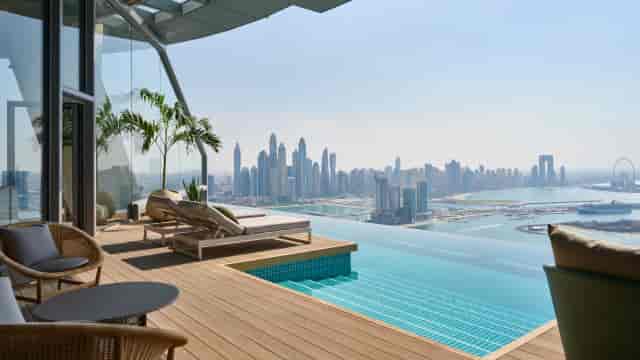 Indoor Lounge at AURA SkyPool with infinity pool and city skyline, ideal for upscale events.