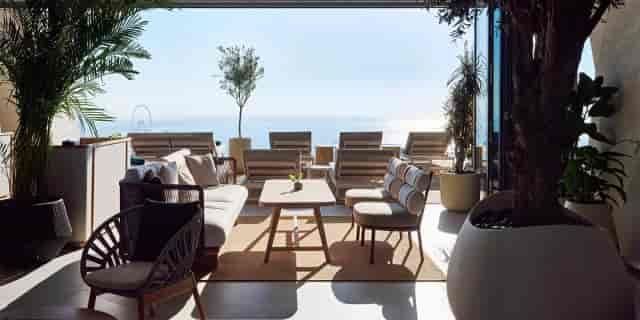 Stylish indoor lounge with ocean view, perfect for networking events and meetings.