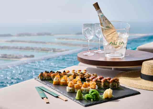 Luxurious sushi dining setup at AURA SkyPool's Palm View Deck for exclusive events.