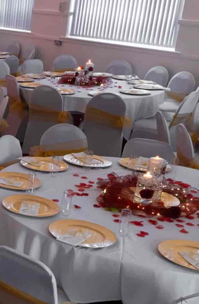 Elegant banquet hall with round tables, perfect for weddings and formal events.