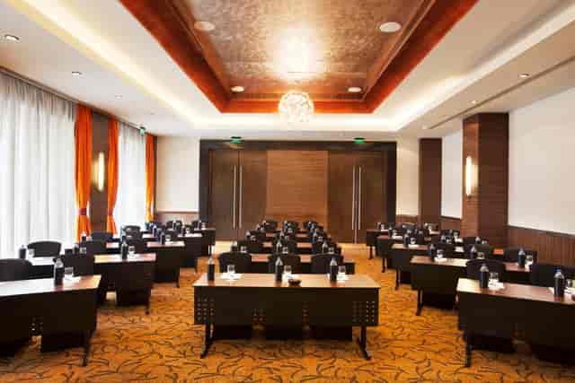 Burgundy meeting room at Novotel Mumbai, ideal for corporate workshops and seminars.