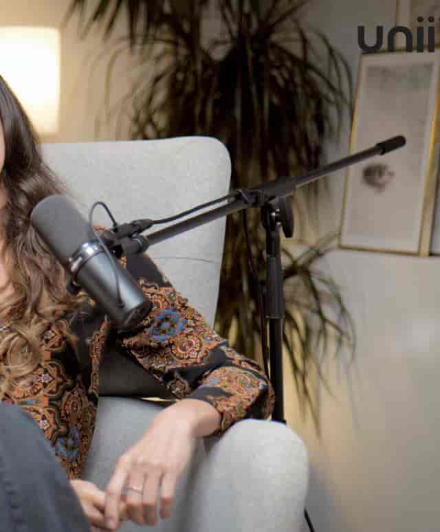 Podcast studio with high-quality microphone and inviting seating for engaging discussions.