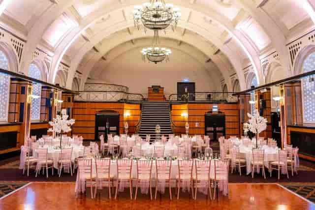 Elegant banquet hall with white linens and pink accents at Royal Bath Hotel Bournemouth.