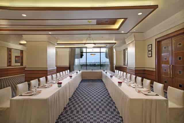 Corporate meeting room at Sunset Lounge, Mumbai with elegant decor and natural light.