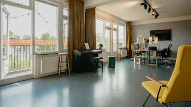 Bright meeting space with large windows, ideal for workshops and team meetings.