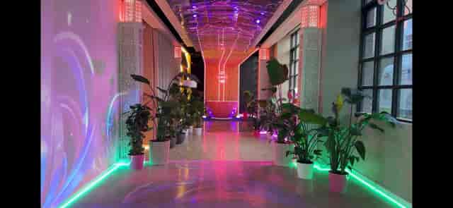 Vibrant ARTBOX event space with colorful lighting, perfect for networking and gatherings.