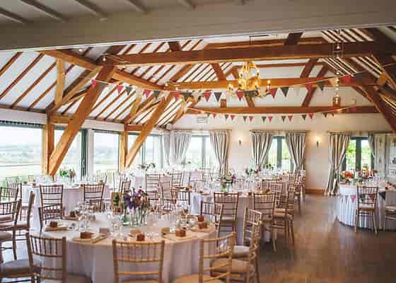Elegant Bredon Room event space with round tables, ideal for weddings and gatherings.