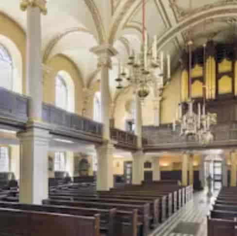 St Giles in the Fields Church event space with elegant chandeliers and natural light.