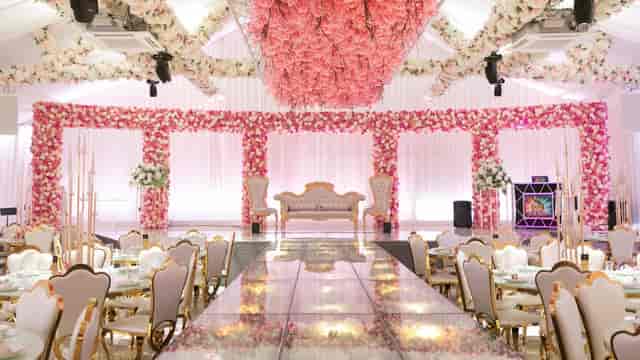Elegant Grand Botanical Suite event space with floral backdrop, ideal for weddings and galas.