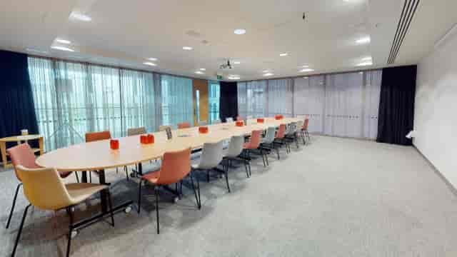 Modern boardroom with oval table, ideal for workshops in Jewellery Quarter Conference Centre.