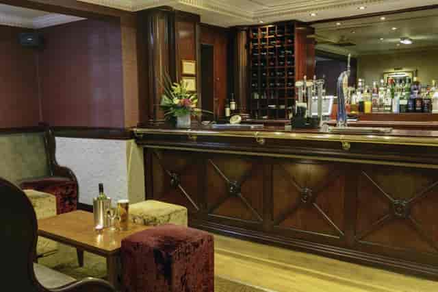 Westley Suite bar area with plush seating, ideal for networking events and meetings.
