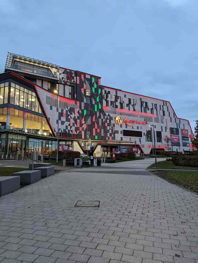 Modern NEC Birmingham auditorium with vibrant façade for versatile events and gatherings.
