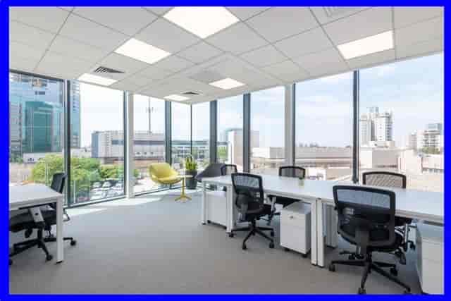 Modern office space with large windows, perfect for meetings and events at The Mailbox.