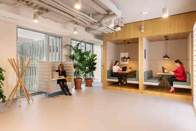 Modern flexible workspace with cozy booths for collaboration at Spaces The Mailbox.