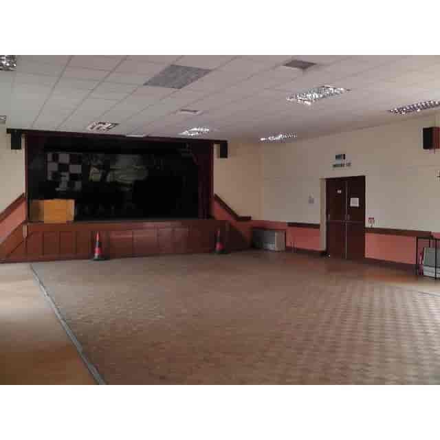 Spacious empty event venue with stage in St Chad's Erdington for meetings and performances.