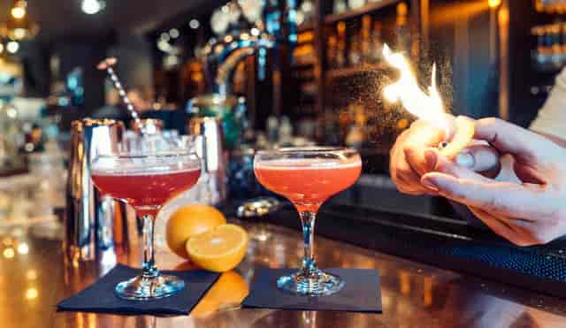 Elegant cocktails at Aluna Birmingham's vibrant cocktail bar, ideal for upscale events.