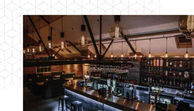 Stylish bar area at Brick & Beam, perfect for networking events and gatherings.