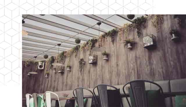 Stylish function room with glass ceiling, perfect for meetings and social gatherings.