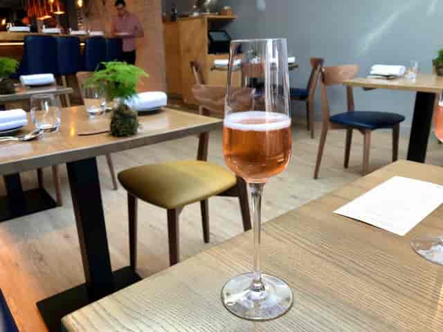 Stylish Harborne Kitchen bar with sparkling rosé, ideal for corporate events and gatherings.