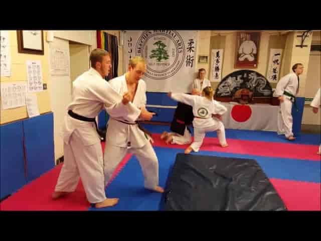 Jujitsu training session on vibrant mats at Beeches Martial Arts for team-building events.