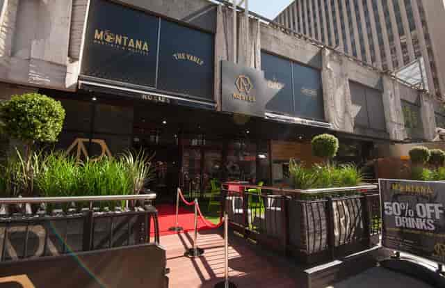 Vibrant R1 venue entrance with red carpet, perfect for events and networking.