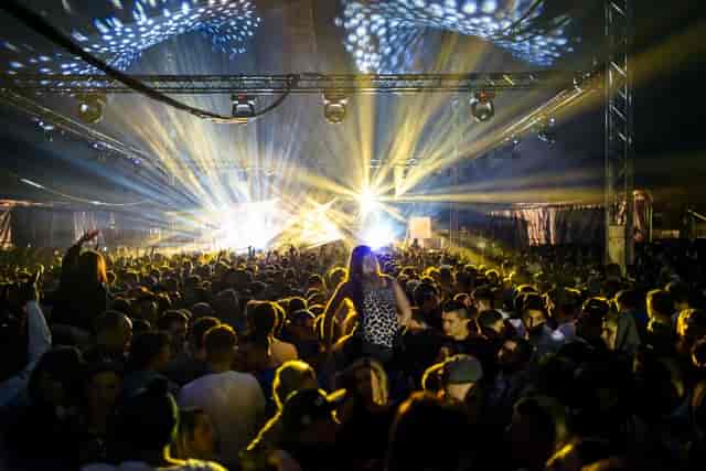 Vibrant nightclub crowd with dynamic lighting at The Electric event.