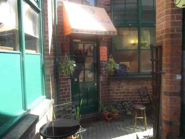 Charming entrance of 24K Bistro, perfect for intimate meetings and casual gatherings.