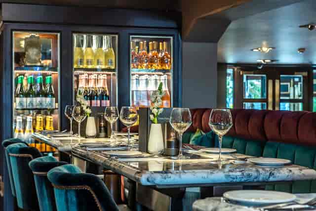 Elegant dining setup in The Lyttelton Arms courtyard for upscale events and gatherings.