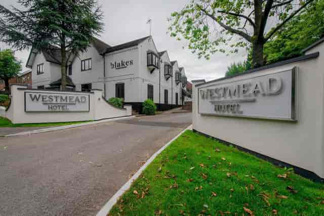Westmead Hotel entrance with modern facade, ideal for corporate events and meetings.