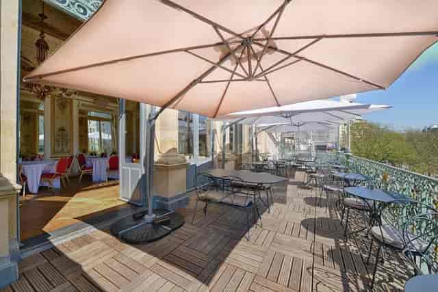Stylish outdoor terrace at Théâtre du Gymnase, ideal for events and gatherings.