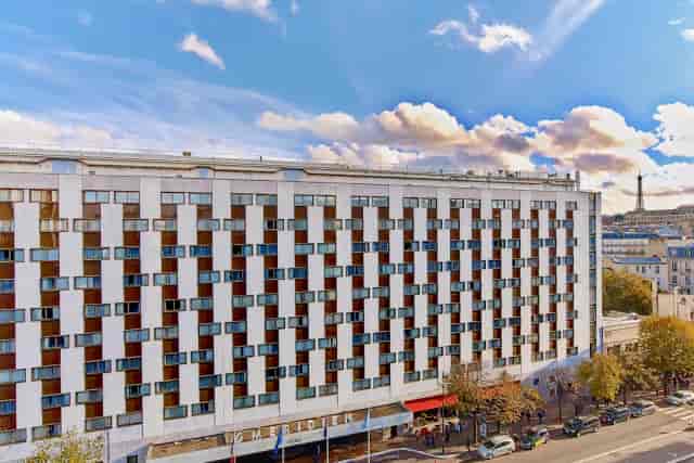 Modern hotel facade at Le Méridien Etoile, ideal for corporate events and meetings.