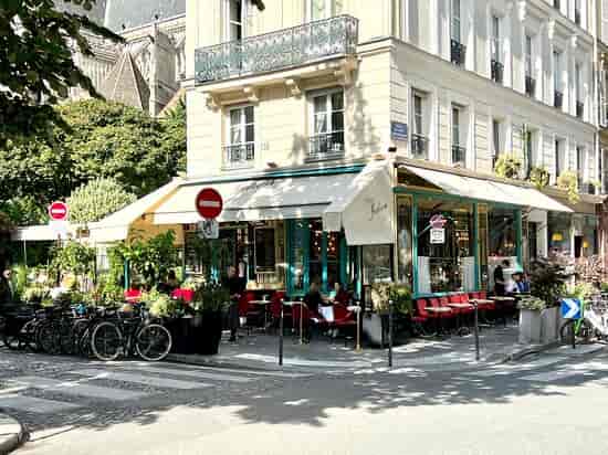 Charming outdoor café at Chez Julien, ideal for casual meetings and networking events.