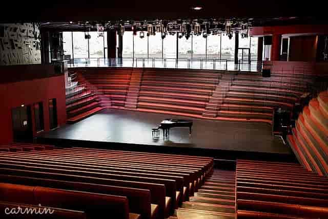 Théâtre Claude Lévi-Strauss foyer with tiered seating, ideal for concerts and events.