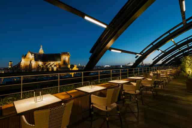 Rooftop bar at Hôtel Madame Rêve, modern design for upscale cocktail receptions.