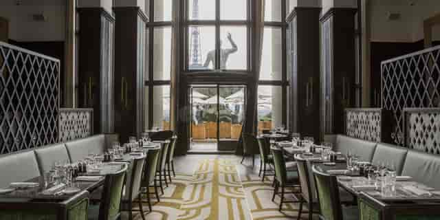 Private dining room at Café de l'Homme with elegant tables for events and gatherings.