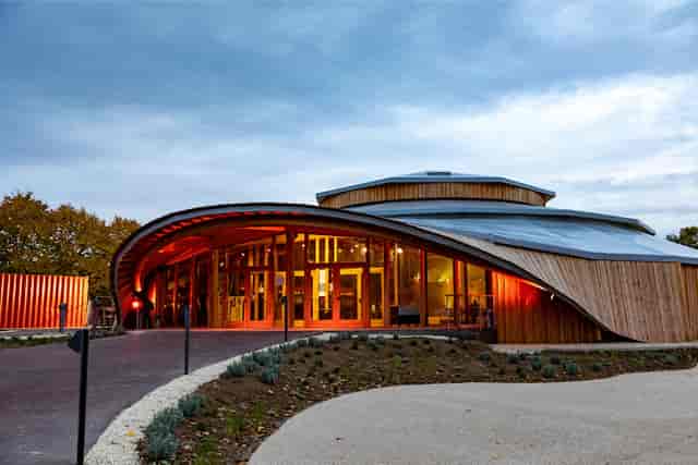 Loges at Cabaret Sauvage: modern venue with wooden exterior for events and meetings.