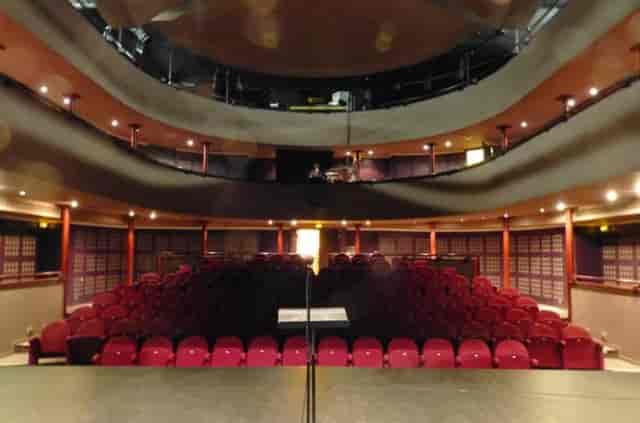 Salle de spectacles theater with tiered seating for events and presentations.