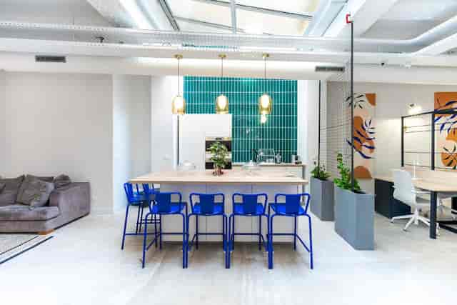 Modern coworking space with blue seating, ideal for networking events and meetings.