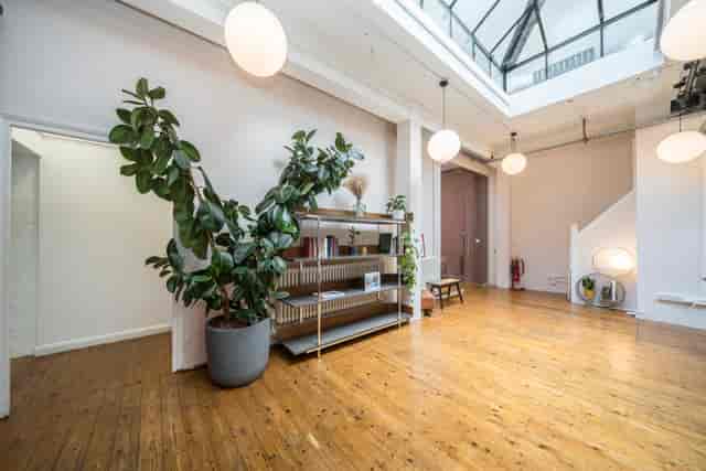 Spacious Menier Playhouse venue with skylight, ideal for workshops and events.