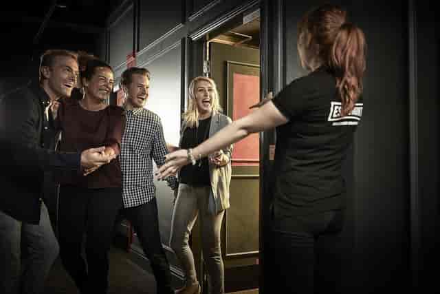 Lively group at Print & Play event in Escape Hunt London, fostering networking and collaboration.