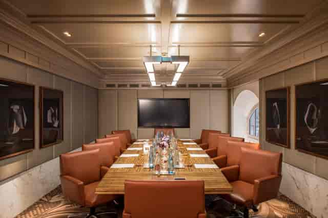 Elegant boardroom with leather chairs, perfect for corporate meetings and executive retreats.