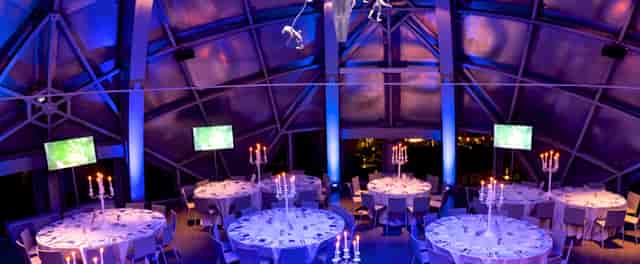 Elegant event space in Atomium with candelabras, ideal for corporate gatherings.