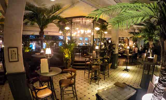 Private dining room at The Botanist Cardiff, featuring lush greenery for upscale events.