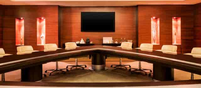 Modern conference room in Abu Dhabi with sleek table, ideal for executive meetings.