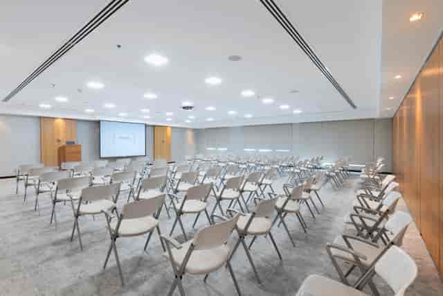 Modern conference room in Dubai with rows of chairs for corporate events.